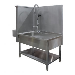 Sink set with draining board and knee-operated washbasin.